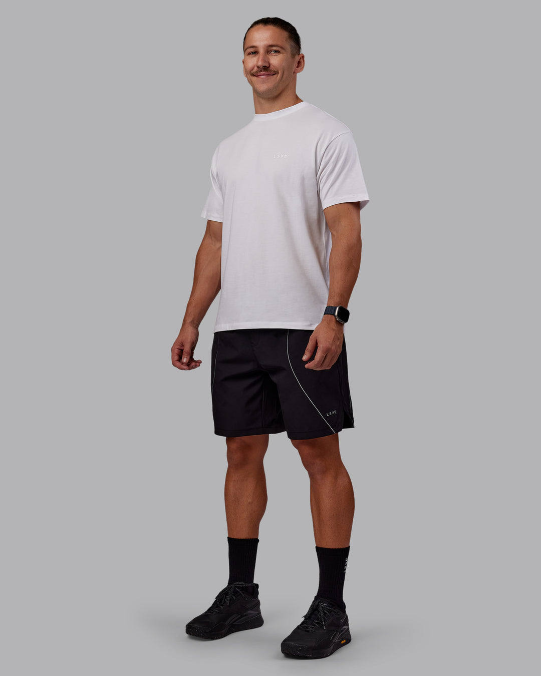 Man wearing Nocturnal 8” Short - Black | Model:Jaiden | Size:M