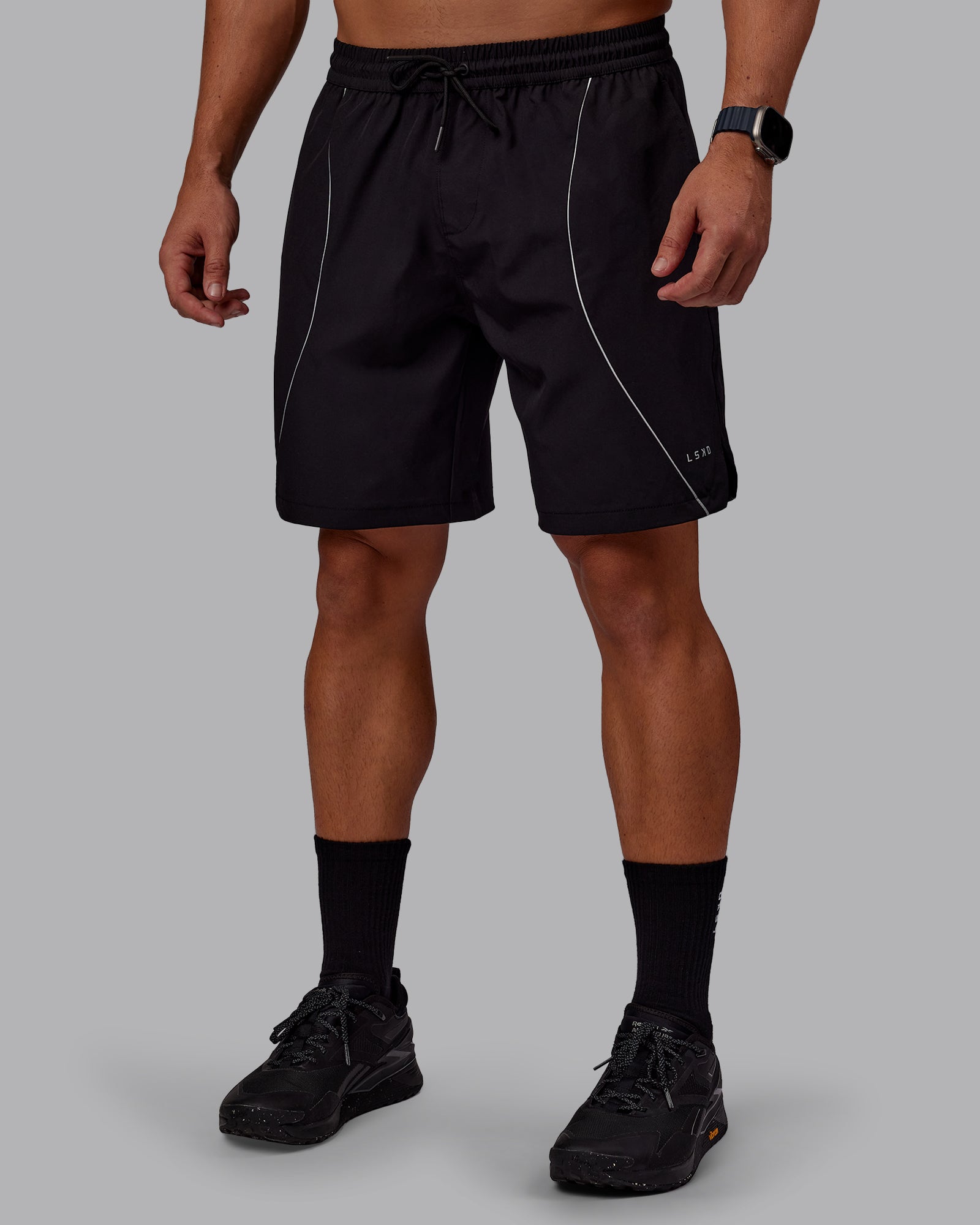 Man wearing Nocturnal 8” Short - Black | Model:Jaiden | Size:M