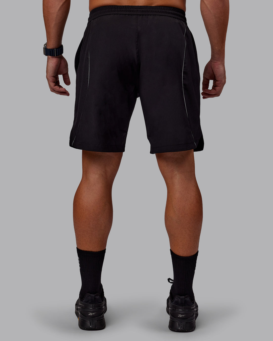 Man wearing Nocturnal 8” Short - Black | Model:Jaiden | Size:M