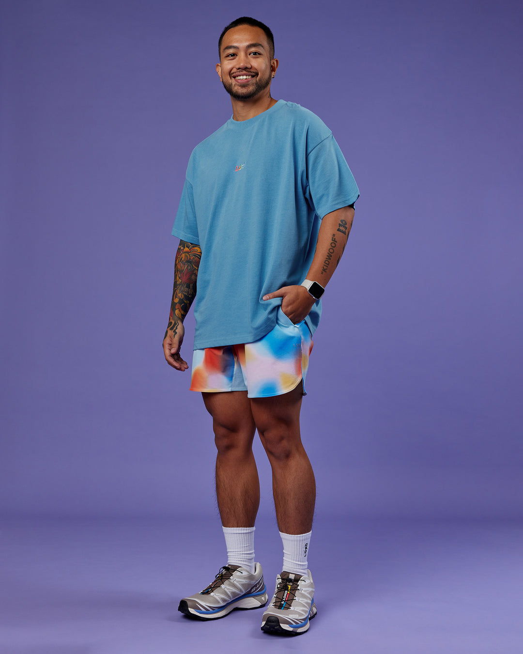 Man wearing Our Journey Heavyweight Oversized Tee - Azure Blue-Rainbow | Model:Justin | Size:M
