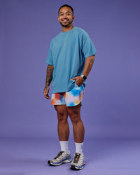 Man wearing Our Journey Heavyweight Oversized Tee - Azure Blue-Rainbow | Model:Justin | Size:M