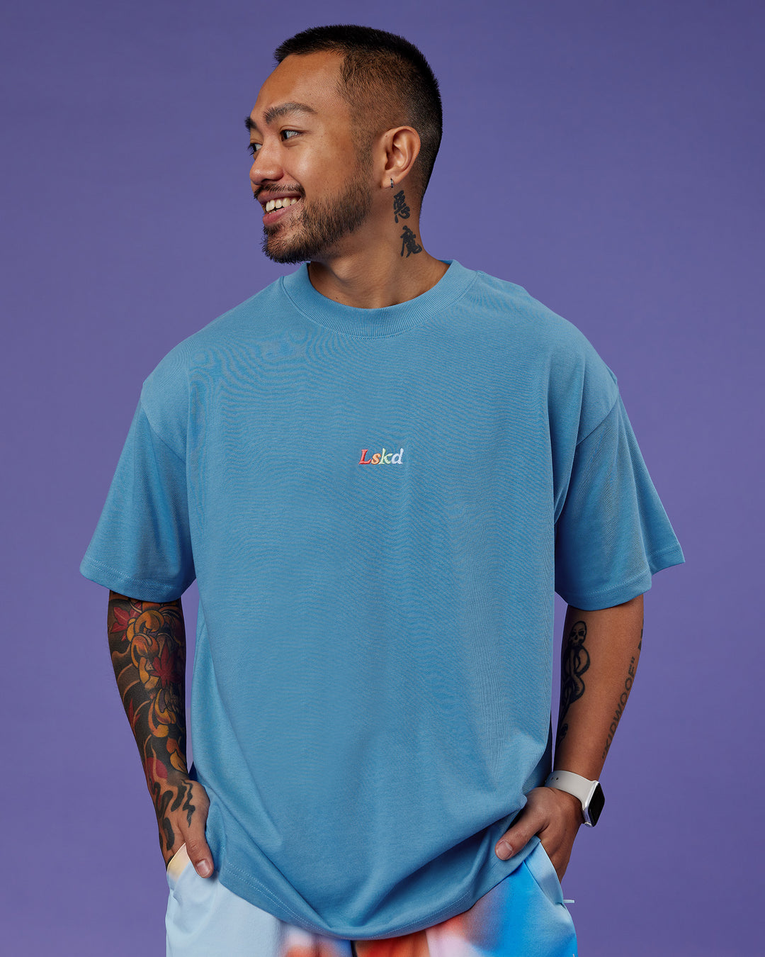 Man wearing Our Journey Heavyweight Oversized Tee - Azure Blue-Rainbow | Model:Justin | Size:M