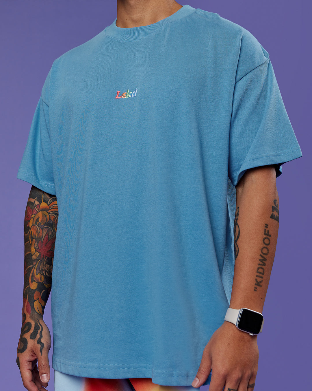 Man wearing Our Journey Heavyweight Oversized Tee - Azure Blue-Rainbow | Model:Justin | Size:M