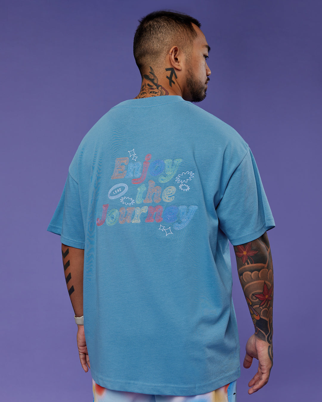 Man wearing Our Journey Heavyweight Oversized Tee - Azure Blue-Rainbow | Model:Justin | Size:M