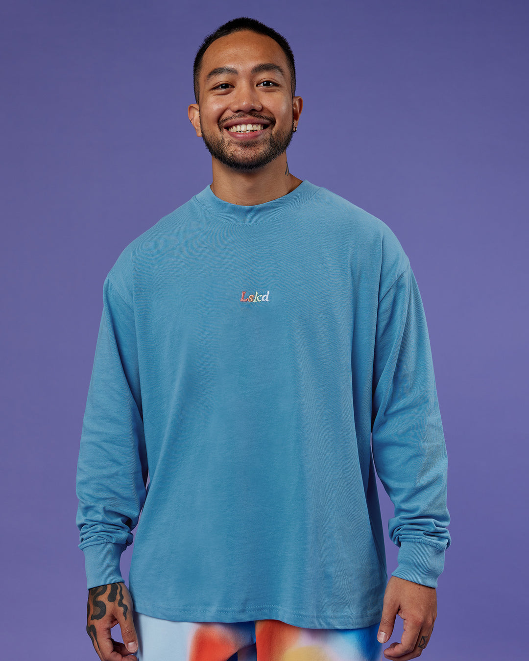Man wearing Our Journey Oversize Heavyweight FLXCotton Long Sleeve Tee - Azure Blue | Model:Justin | Size:M