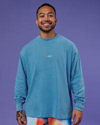 Man wearing Our Journey Oversize Heavyweight FLXCotton Long Sleeve Tee - Azure Blue | Model:Justin | Size:M