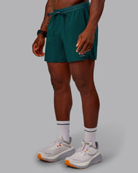 Man wearing Pace Lined Performance Short  5" in Dark Moss | Size:M