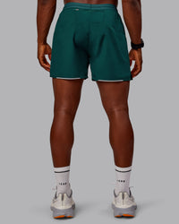 Man wearing Pace Lined Performance Short  5" in Dark Moss | Size:M