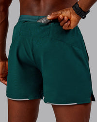 Man wearing Pace Lined Performance Short  5" in Dark Moss | Size:M