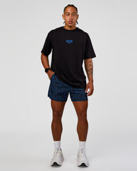 Man wearing Pace 5" Lined Running Short - Energy Print Palace Blue | Model:Malebo | Size:M