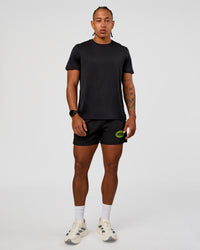 Man wearing Pace 5" Lined Running Short - Black-Lime Glo Indigo | Model:Malebo | Size:M
