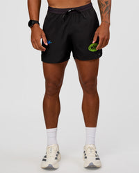 Man wearing Pace 5" Lined Running Short - Black-Lime Glo Indigo | Model:Malebo | Size:M