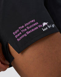 Man wearing Pace 5" Lined Running Short - Black-Ultra Fuchsia | Model:Daarian | Size:M