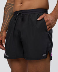 Man wearing Pace 5" Lined Running Short - Black-Ultra Fuchsia | Model:Daarian | Size:M