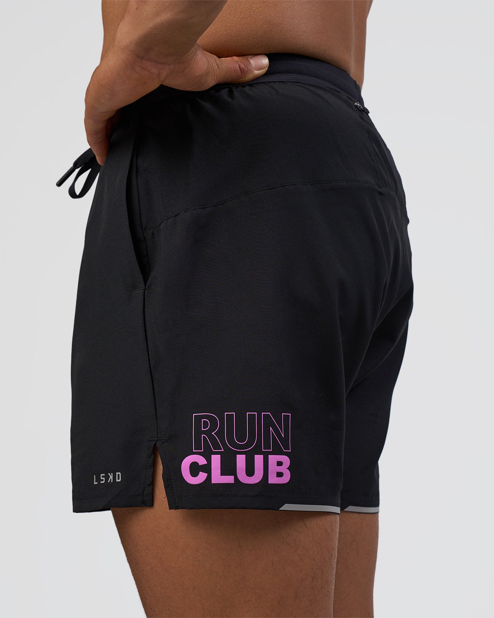 Man wearing Pace 5" Lined Running Short - Black-Ultra Fuchsia | Model:Daarian | Size:M