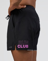 Man wearing Pace 5" Lined Running Short - Black-Ultra Fuchsia | Model:Daarian | Size:M