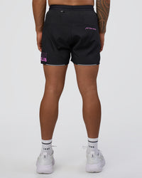 Man wearing Pace 5" Lined Running Short - Black-Ultra Fuchsia | Model:Daarian | Size:M