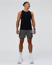 Man wearing Pace 5" Lined Running Short - Dark Storm-Alloy | Model:Jaiden | Size:M