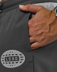 Man wearing Pace 5" Lined Running Short - Dark Storm-Alloy | Model:Jaiden | Size:M