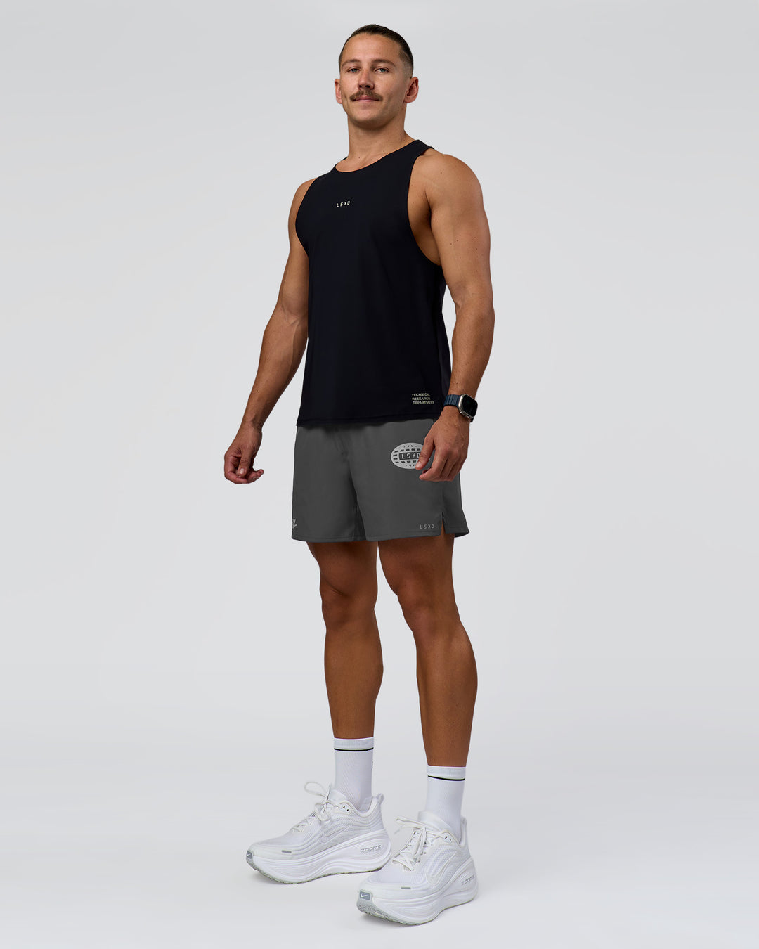 Man wearing Pace 5" Lined Running Short - Dark Storm-Alloy | Model:Jaiden | Size:M
