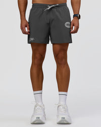Man wearing Pace 5" Lined Running Short - Dark Storm-Alloy | Model:Jaiden | Size:M