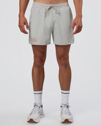 Man wearing Pace 5" Lined Running Short - Digital Mist-Flame | Model:Konnor | Size:M