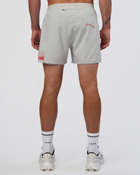 Man wearing Pace 5" Lined Running Short - Digital Mist-Flame | Model:Konnor | Size:M