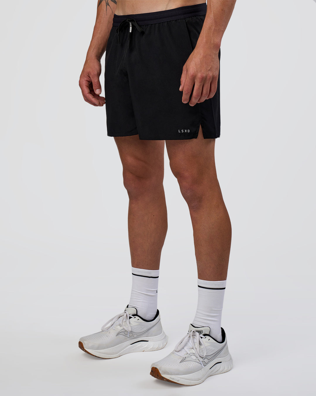 Man wearing Pace 5" Running Short - Black | Model:Konnor | Size:M