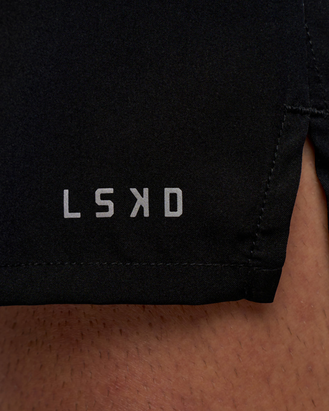 Man wearing Pace 5" Running Short - Black | Model:Konnor | Size:M