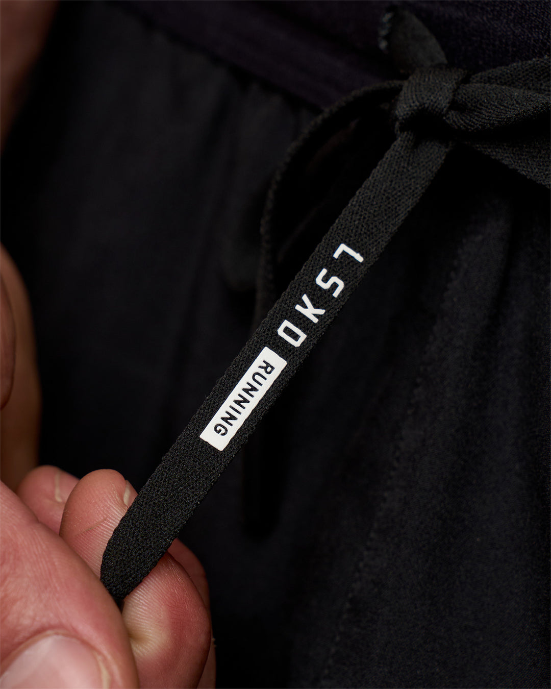 Man wearing Pace 5" Running Short - Black | Model:Konnor | Size:M