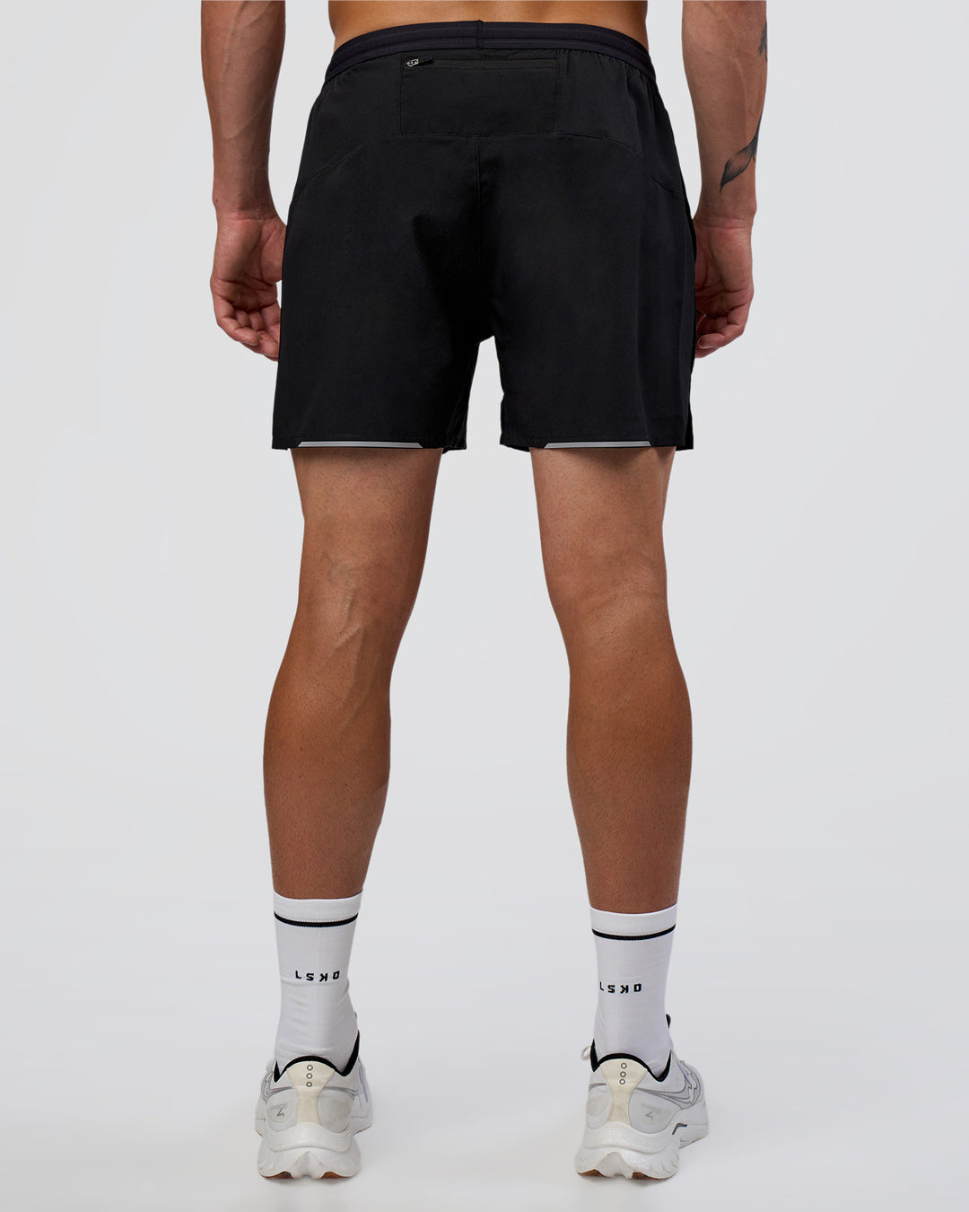 Man wearing Pace 5" Running Short - Black | Model:Konnor | Size:M