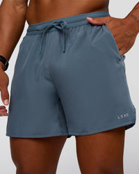 Man wearing Pace 5" Running Short - Blue Mirage | Model:Malebo | Size:M
