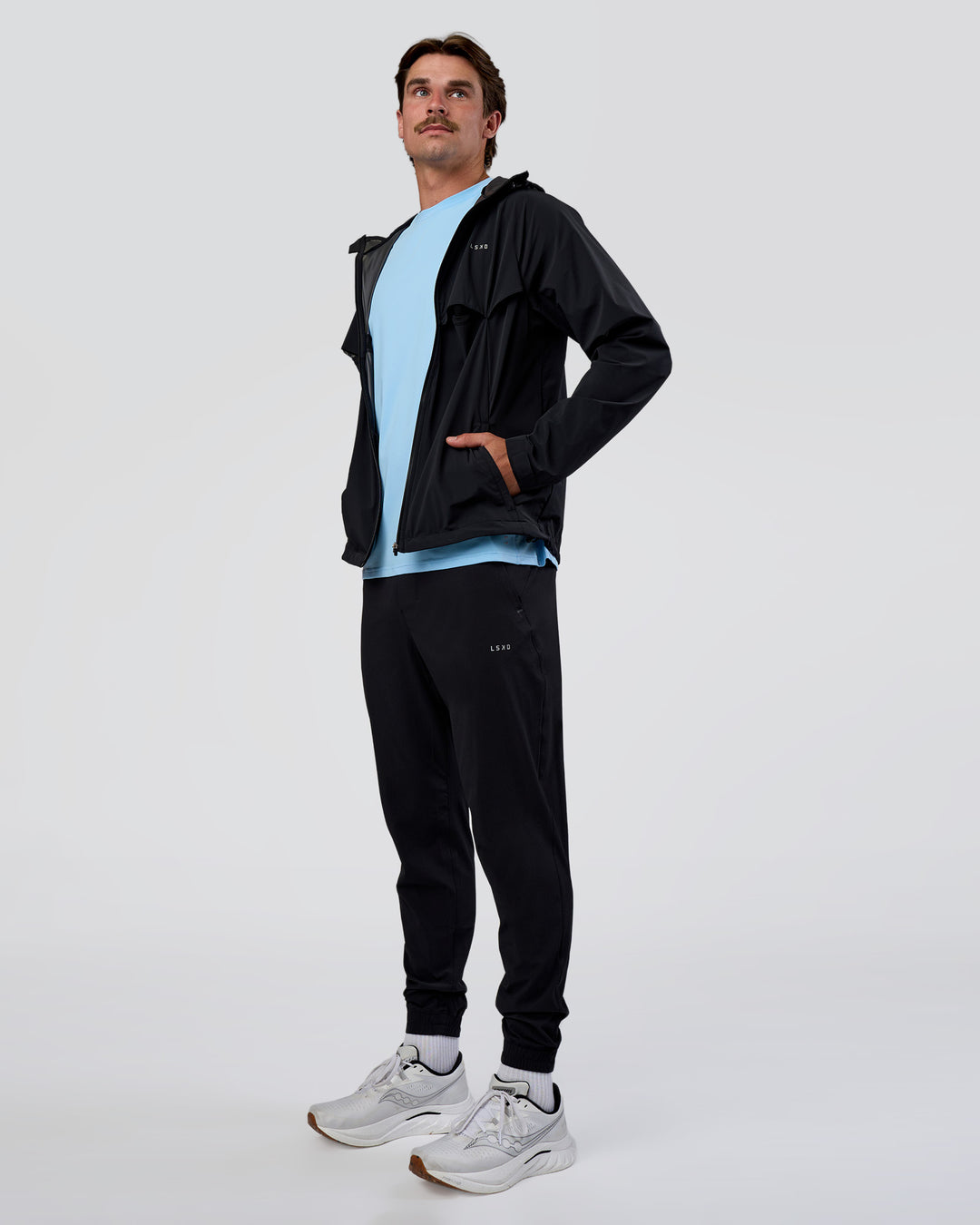 Man wearing Pace Running Jacket - Black | Model:Konnor | Size:M