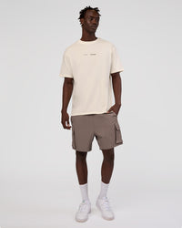 Man wearing Peaches x LSKD Collection FLXCotton Oversize Tee - Off White | Model:Okello | Size:M