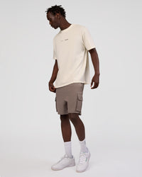 Man wearing Peaches x LSKD Collection FLXCotton Oversize Tee - Off White | Model:Okello | Size:M