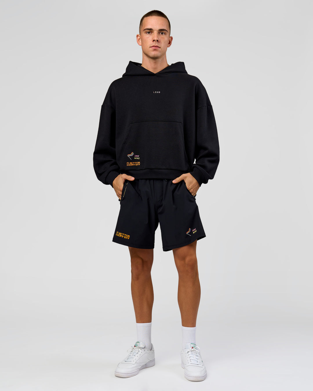 Man wearing Pride Sticker Boxy Hoodie - Black | Model:Albert | Size:M