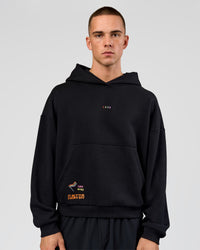 Man wearing Pride Sticker Boxy Hoodie - Black | Model:Albert | Size:M