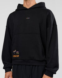 Man wearing Pride Sticker Boxy Hoodie - Black | Model:Albert | Size:M