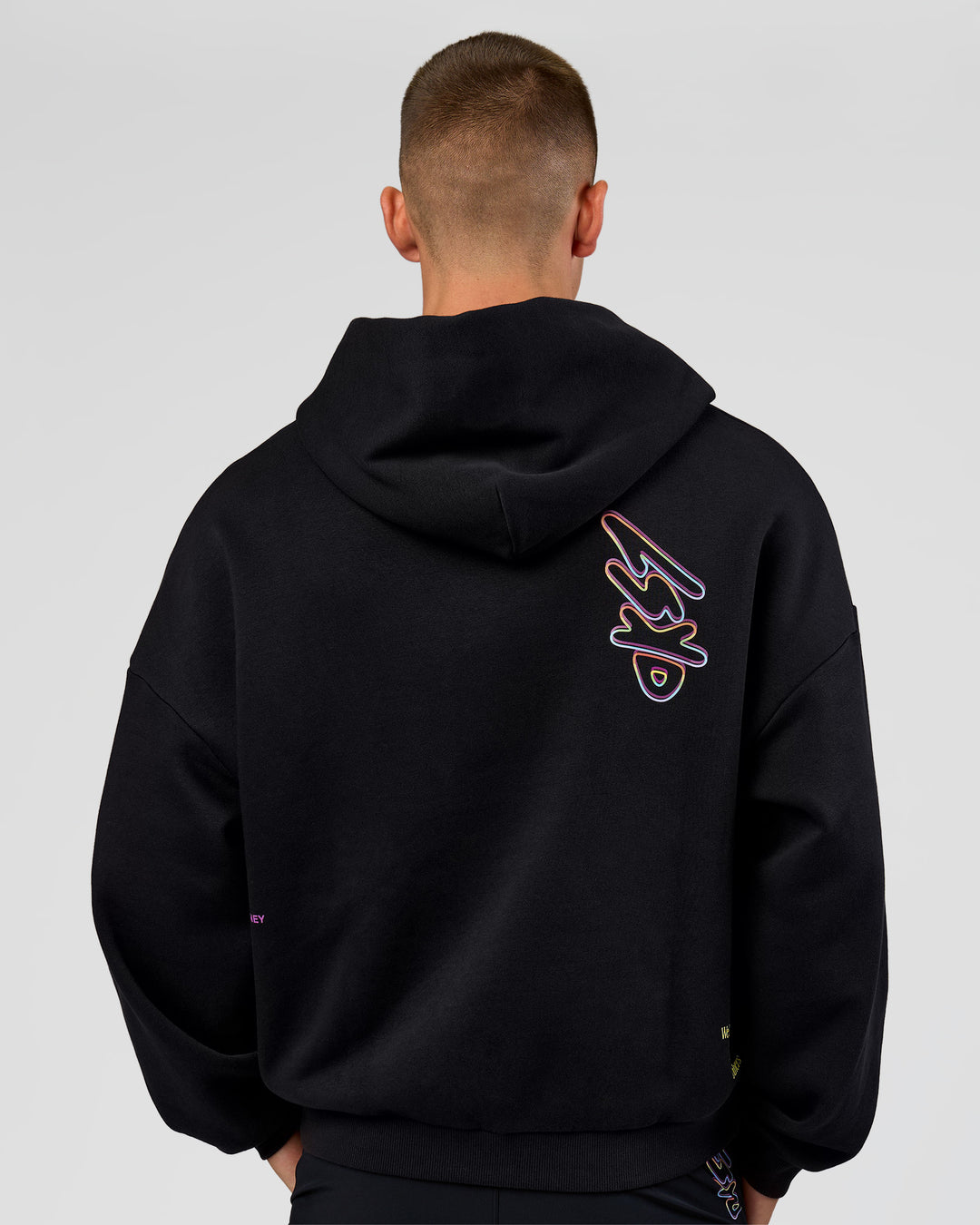 Man wearing Pride Sticker Boxy Hoodie - Black | Model:Albert | Size:M