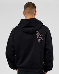 Man wearing Pride Sticker Boxy Hoodie - Black | Model:Albert | Size:M