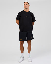 Man wearing Pride Sticker Boxy Tee - Black | Model:Albert | Size:M
