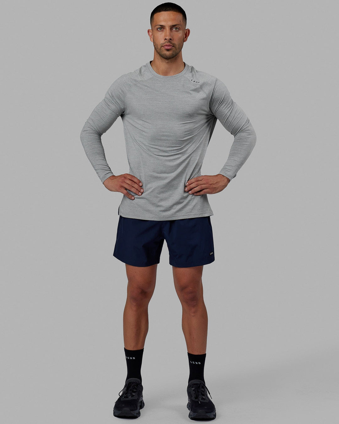 Man wearing Rep 5" Performance Short - Navy