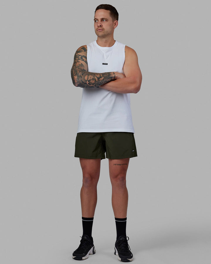 Man wearing Rep 5'' Performance Short - Forest Night-Lime
