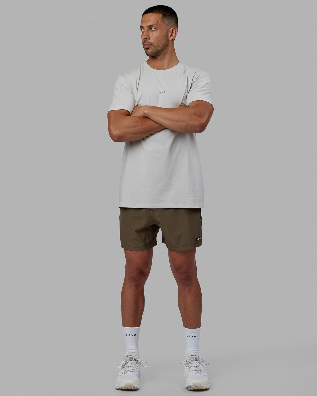 Man wearing Rep 5'' Performance Short - Olive Leaf