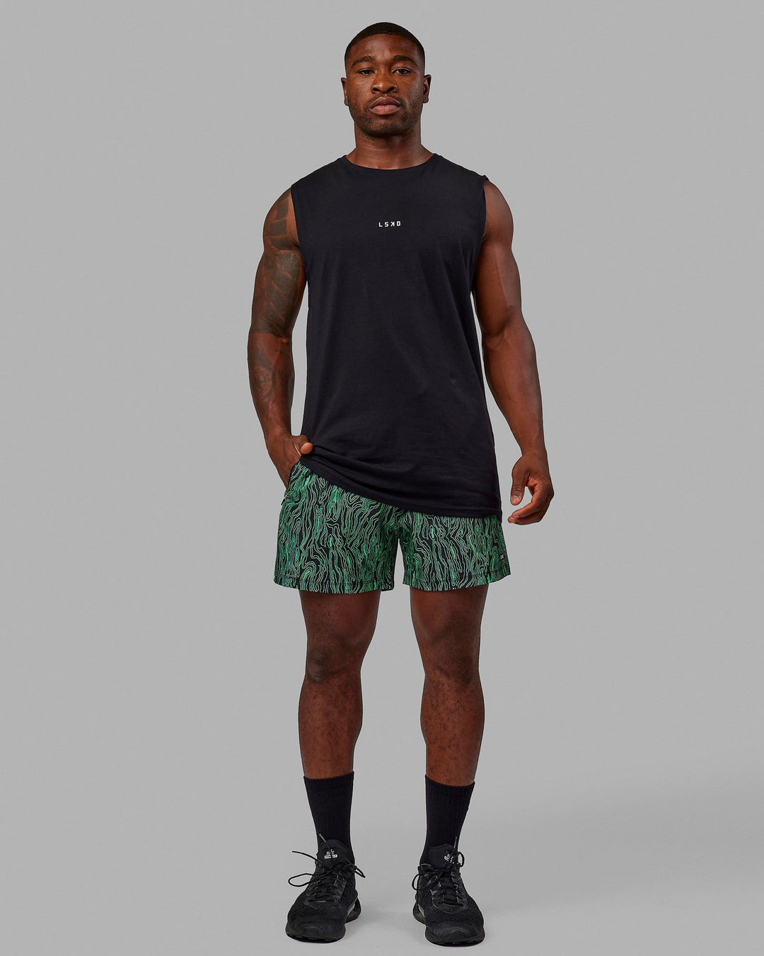 Man wearing Rep 5" Performance Shorts - Topographic Black-Lime
