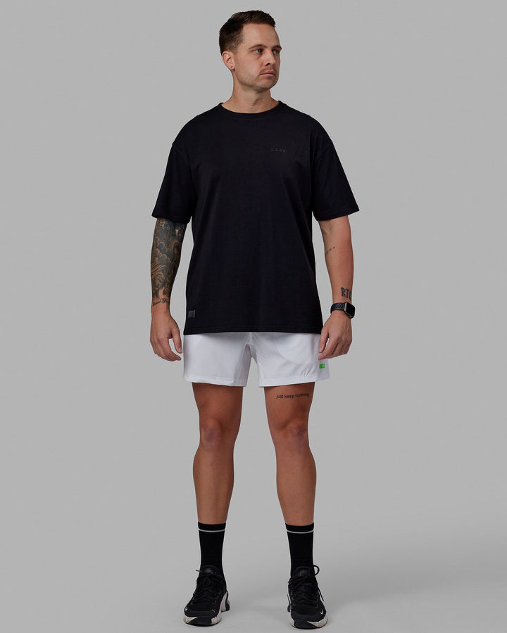 Man wearing Rep 5'' Performance Short - White-Lime