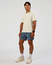 Man wearing Rep 5" Performance Short - Blue Mirage | Model:George | Size:M