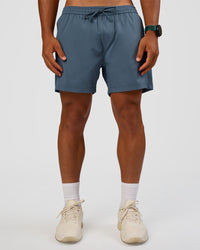 Man wearing Rep 5" Performance Short - Blue Mirage | Model:George | Size:M