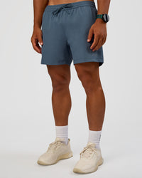 Man wearing Rep 5" Performance Short - Blue Mirage | Model:George | Size:M