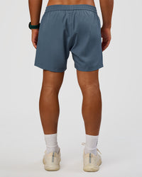 Man wearing Rep 5" Performance Short - Blue Mirage | Model:George | Size:M